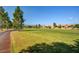 Beautiful golf course with lush green fairways and scenic mountain views in the background at 7760 Pine Warbler Way, North Las Vegas, NV 89084