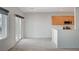 Bright open space featuring modern kitchen with a breakfast bar, flowing into a spacious tiled dining area at 7760 Pine Warbler Way, North Las Vegas, NV 89084