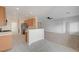 Bright kitchen seamlessly connects to living area, stainless steel appliances and counter seating, modern design at 7760 Pine Warbler Way, North Las Vegas, NV 89084