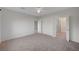 Spacious main bedroom with neutral carpet and ensuite bathroom with tile flooring at 7760 Pine Warbler Way, North Las Vegas, NV 89084