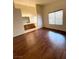 A spacious bedroom features hard wood floors and large window for natural light at 7821 Desert Bell Ave, Las Vegas, NV 89128