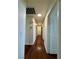 The hallway features wooden floors, neutral walls, and multiple doorways at 7821 Desert Bell Ave, Las Vegas, NV 89128