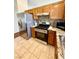 Well-equipped kitchen with stainless steel appliances, tile backsplash, and granite countertops at 7821 Desert Bell Ave, Las Vegas, NV 89128