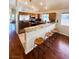 An open kitchen offers stainless steel appliances, granite countertops, and a breakfast bar at 7821 Desert Bell Ave, Las Vegas, NV 89128