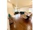 The spacious living room features hardwood floors, large windows and tastefully coordinated furnishings throughout at 7821 Desert Bell Ave, Las Vegas, NV 89128