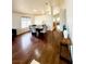 Inviting living area with wood floors, neutral paint, and views into the dining area and beyond at 7821 Desert Bell Ave, Las Vegas, NV 89128