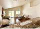 An open living space with neutral tones, a fireplace, and access to the outdoor space at 7821 Desert Bell Ave, Las Vegas, NV 89128
