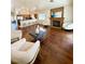 Bright living room featuring a fireplace, hard wood floors, and neutral furniture at 7821 Desert Bell Ave, Las Vegas, NV 89128