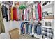 Organized walk-in closet with shelving, hanging rods, and a laundry basket at 8009 Tailwind Ave, Las Vegas, NV 89131