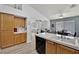 Kitchen featuring an open layout, black appliances and barstool seating at 8009 Tailwind Ave, Las Vegas, NV 89131
