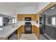 Functional kitchen with black appliances, light wood cabinets, and tile countertops at 8009 Tailwind Ave, Las Vegas, NV 89131