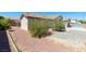Landscape and foliage surrounds a well maintained backyard at 8249 Jo Marcy Dr, Las Vegas, NV 89131