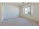 Cozy bedroom with large window, plush carpet and neutral paint at 8249 Jo Marcy Dr, Las Vegas, NV 89131
