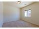 Bedroom featuring neutral carpet, recessed lighting, and a window allowing natural light at 8249 Jo Marcy Dr, Las Vegas, NV 89131