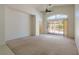 Bright, airy living room with high ceilings and sliding glass doors leading to the patio at 8249 Jo Marcy Dr, Las Vegas, NV 89131