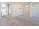 Bright living room with neutral carpeting, high ceilings, and ample natural light at 8249 Jo Marcy Dr, Las Vegas, NV 89131