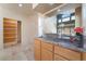 Stylish bar area with granite countertop, perfect for entertaining guests and serving refreshments at 8277 Mount Nido Dr, Las Vegas, NV 89147