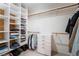 Spacious walk-in closet with built in shelving and drawers providing ample storage space at 8277 Mount Nido Dr, Las Vegas, NV 89147