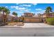 Charming two-story home with a well-manicured front yard and a two car garage at 8277 Mount Nido Dr, Las Vegas, NV 89147
