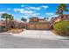 Charming two-story home with a well-manicured front yard and a two car garage at 8277 Mount Nido Dr, Las Vegas, NV 89147