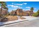 Charming two-story home with a well-manicured front yard and a two car garage at 8277 Mount Nido Dr, Las Vegas, NV 89147