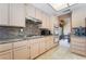 Updated kitchen with granite countertops and modern appliances provides ample space for cooking at 8277 Mount Nido Dr, Las Vegas, NV 89147