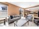 Spacious living room adjacent to kitchen with tile floors and sliding glass door to backyard at 8277 Mount Nido Dr, Las Vegas, NV 89147