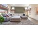 Spacious living room featuring a plush sectional sofa, natural light, and neutral tones at 8277 Mount Nido Dr, Las Vegas, NV 89147