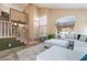 Bright living room with tall ceilings, staircase, and a comfortable sectional sofa at 8277 Mount Nido Dr, Las Vegas, NV 89147