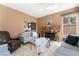 Comfortable living room with stone fireplace and neutral tones, perfect for relaxing or entertaining at 8277 Mount Nido Dr, Las Vegas, NV 89147