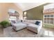 Spacious living room featuring a plush sectional sofa, natural light, and neutral tones at 8277 Mount Nido Dr, Las Vegas, NV 89147