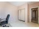 Bright office with neutral walls and tile floor; closet in the corner for storage at 8277 Mount Nido Dr, Las Vegas, NV 89147