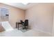 This office space has tile floors and is brightly lit by a window overlooking the side yard at 8277 Mount Nido Dr, Las Vegas, NV 89147