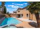 Outdoor swimming pool and patio area perfect for relaxation and entertaining guests at 8277 Mount Nido Dr, Las Vegas, NV 89147