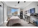 A well-lit bedroom with cozy decor, closet space, and natural light from a window at 8537 Eureka Heights Ct, Las Vegas, NV 89178
