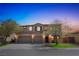 Charming two-story home with a well-manicured lawn and a three-car garage at 8537 Eureka Heights Ct, Las Vegas, NV 89178