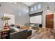Elegant living room with hardwood floors and ample natural light, perfect for relaxation at 8537 Eureka Heights Ct, Las Vegas, NV 89178