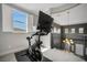 A loft with exercise bike and wrought iron railing, featuring a view of the neighborhood at 8537 Eureka Heights Ct, Las Vegas, NV 89178