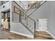 Contemporary staircase with metal railings and a neutral color palette at 8537 Eureka Heights Ct, Las Vegas, NV 89178