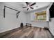 A bright workout room with hardwood flooring, exercise equipment, and plenty of natural light at 8537 Eureka Heights Ct, Las Vegas, NV 89178