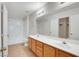 Bright bathroom featuring double vanity, tile floor, and shower-tub combo at 8725 W Flamingo Rd # 240, Las Vegas, NV 89147