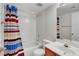 Cozy bathroom with single sink, white tile shower-tub combo, and neutral walls at 8725 W Flamingo Rd # 240, Las Vegas, NV 89147