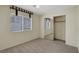 Bedroom featuring neutral carpet, window with blinds, and sliding closet at 8725 W Flamingo Rd # 240, Las Vegas, NV 89147