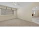 A bright bedroom with carpet and view into another room at 8725 W Flamingo Rd # 240, Las Vegas, NV 89147