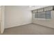 Neutral bedroom with carpet, ceiling fan, and large window at 8725 W Flamingo Rd # 240, Las Vegas, NV 89147