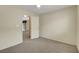 Bedroom featuring neutral carpet and access to the living room at 8725 W Flamingo Rd # 240, Las Vegas, NV 89147