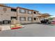 View of the exterior with covered parking at this multi-Gathering residence with desert landscaping at 8725 W Flamingo Rd # 240, Las Vegas, NV 89147