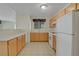 Efficient kitchen featuring bright cabinetry, white appliances, and functional countertop space at 8725 W Flamingo Rd # 240, Las Vegas, NV 89147