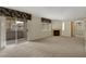 Bright living room featuring fireplace, window, slider to the balcony and neutral paint and flooring at 8725 W Flamingo Rd # 240, Las Vegas, NV 89147