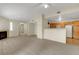 Open concept living room and kitchen with fireplace, neutral paint, and functional layout at 8725 W Flamingo Rd # 240, Las Vegas, NV 89147